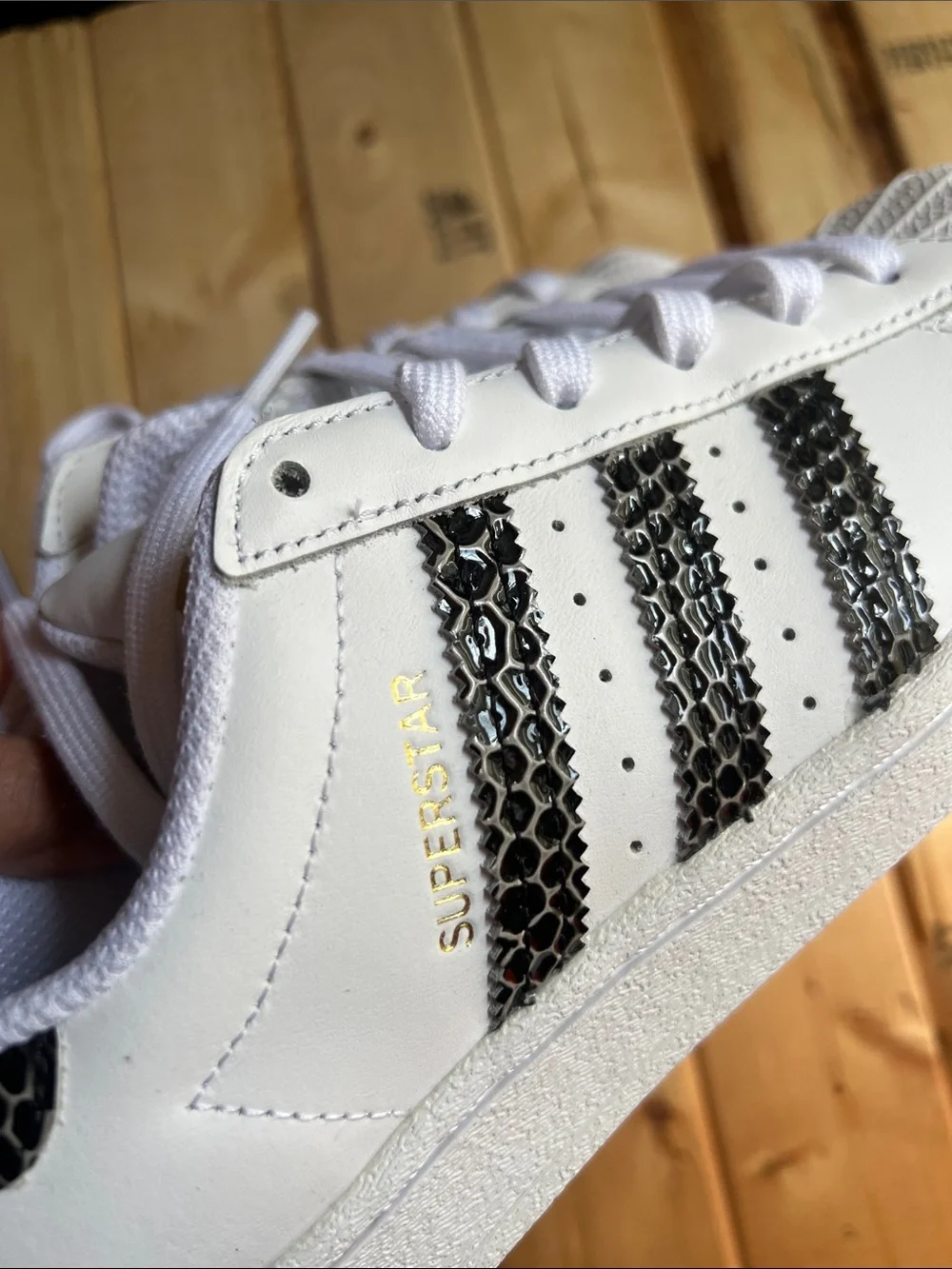 White Superstar Sneakers with Black Snakeskin Stripes